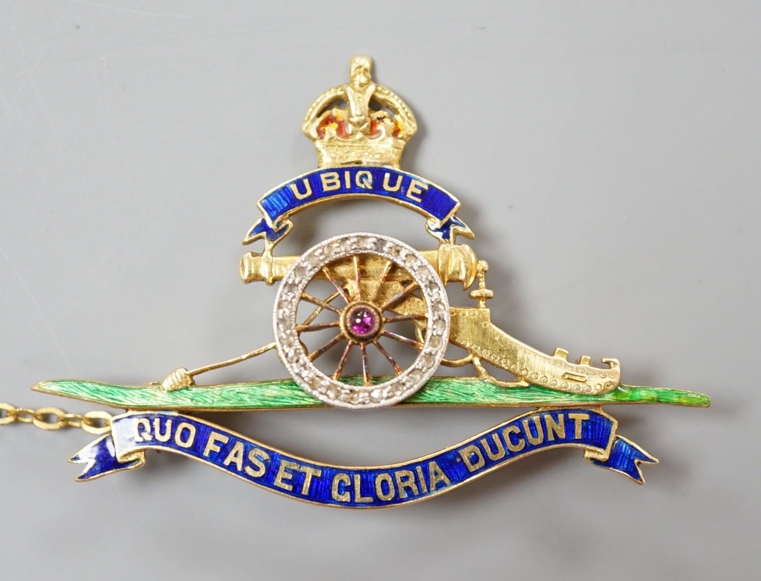 A 20th century yellow metal (stamped 18), enamel and diamond chip set Royal Artillery sweethearts brooch, 43mm, gross weight 8.4 grams.